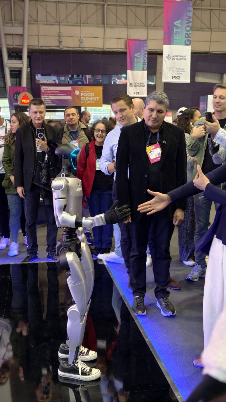 Visitors watching a humanoid robot demonstration at Web Summit